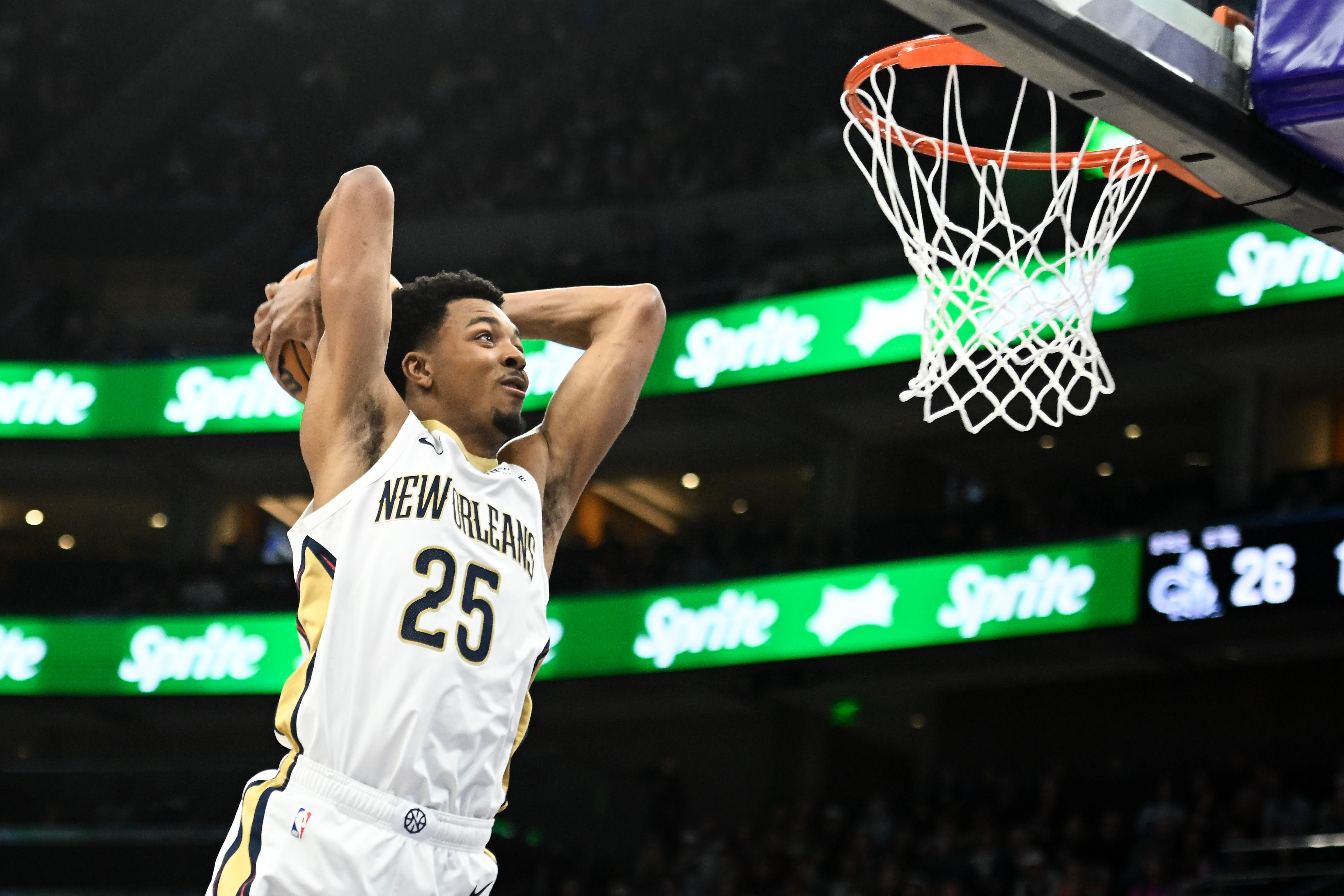 Trey Murphy III goes in for a dunk. 