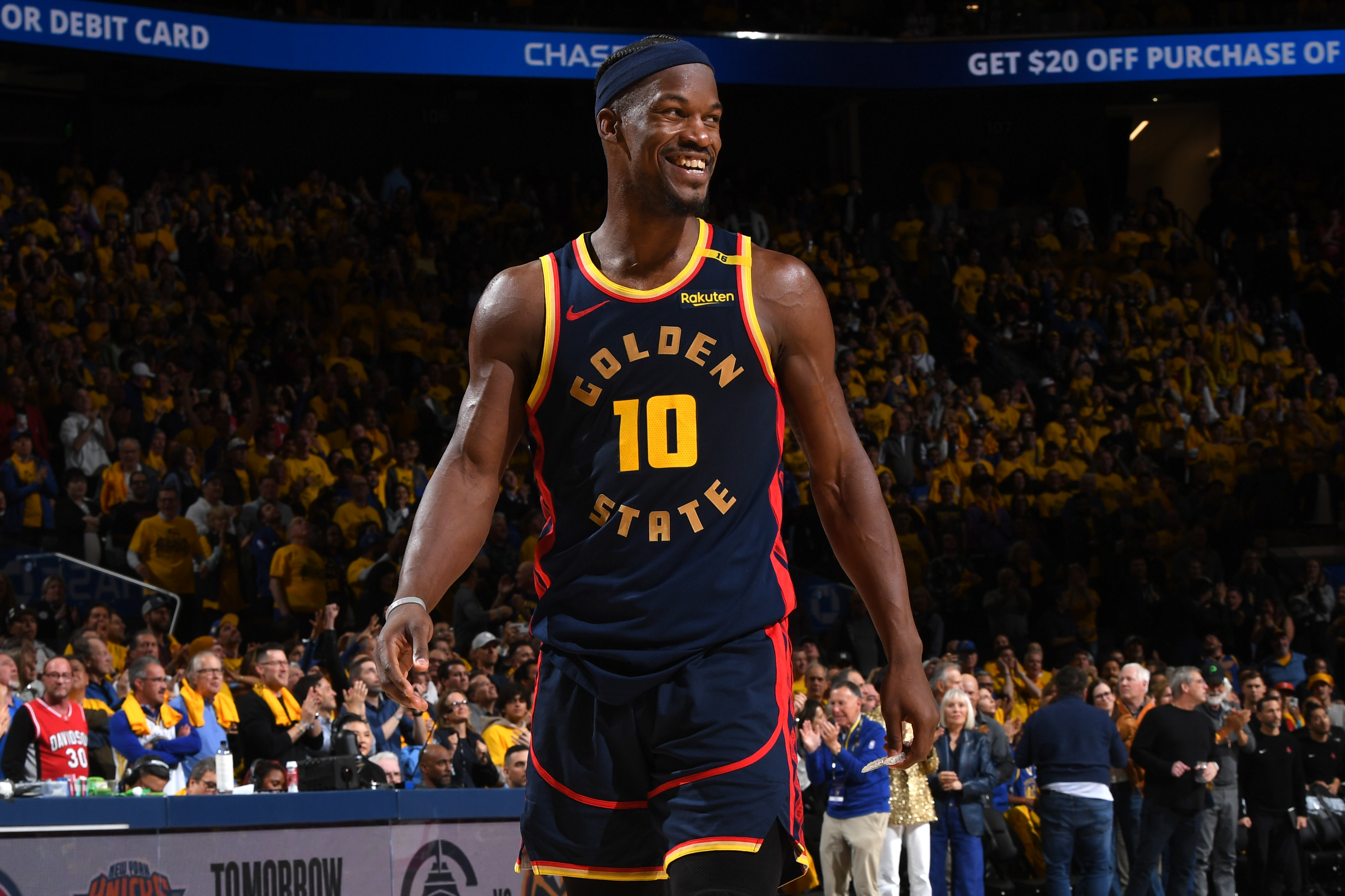 Jimmy Butler III smiles during a game in 2025. 