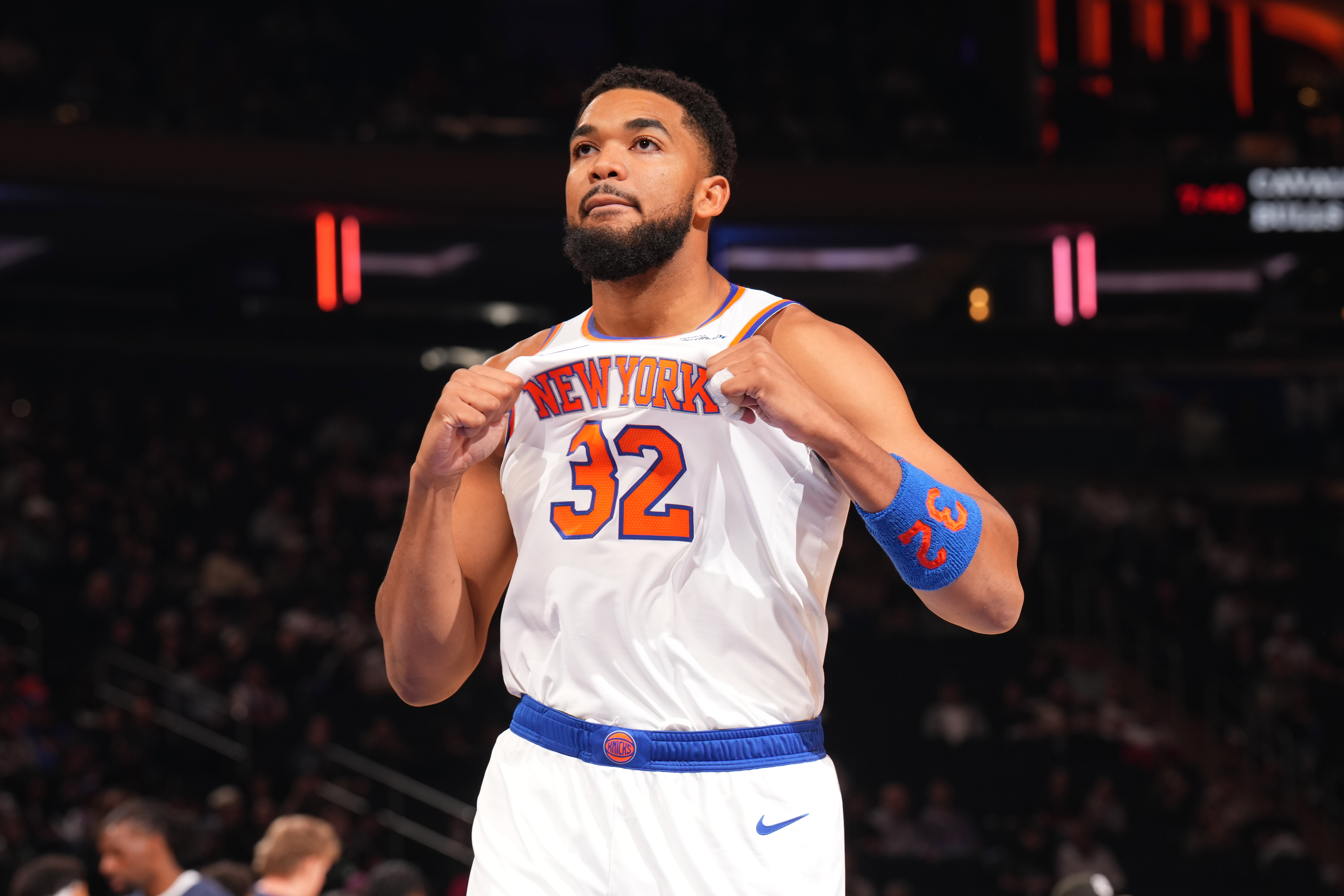 Karl-Anthony Towns pops his jersey. 