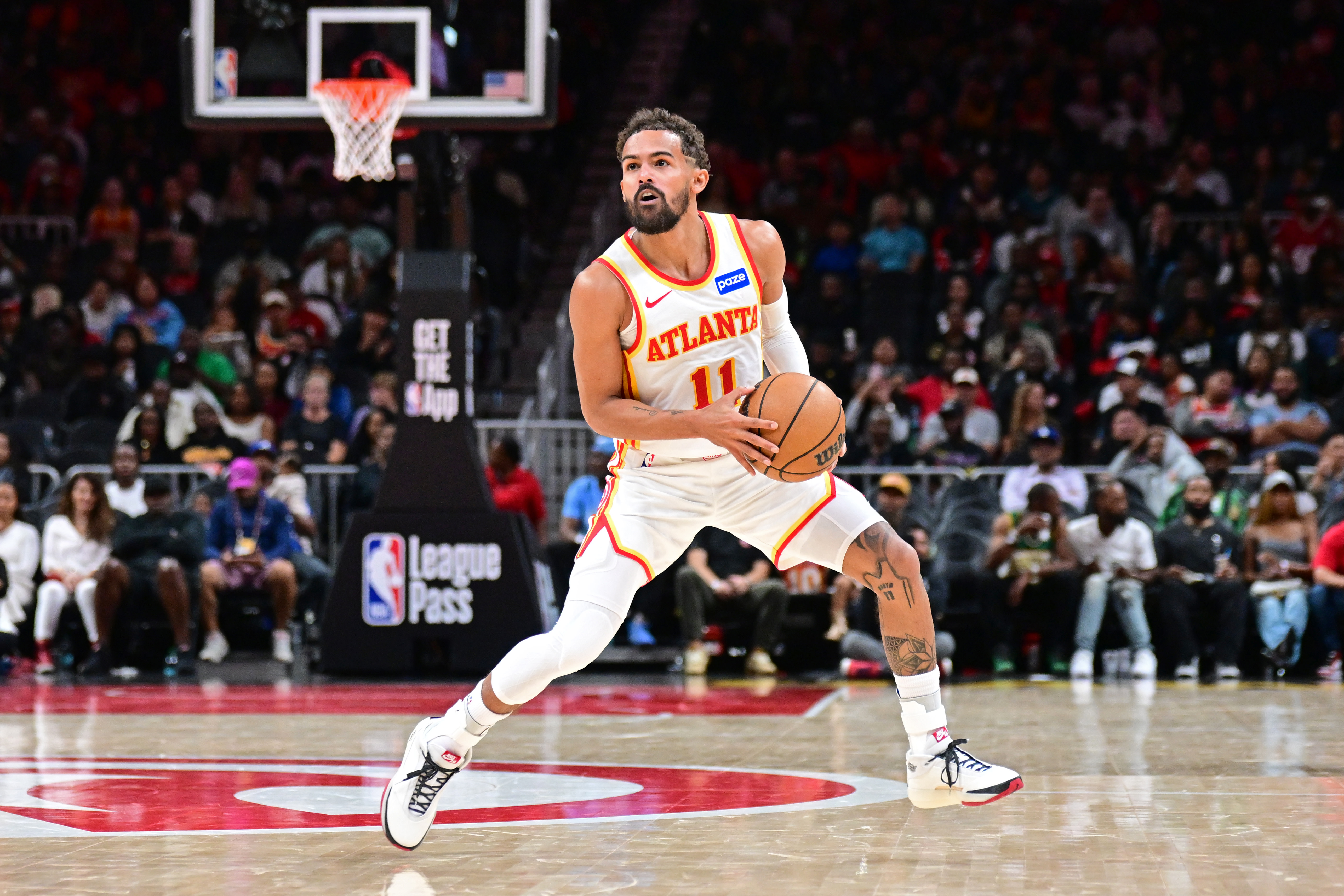 Trae Young steps back for a three-pointer. 