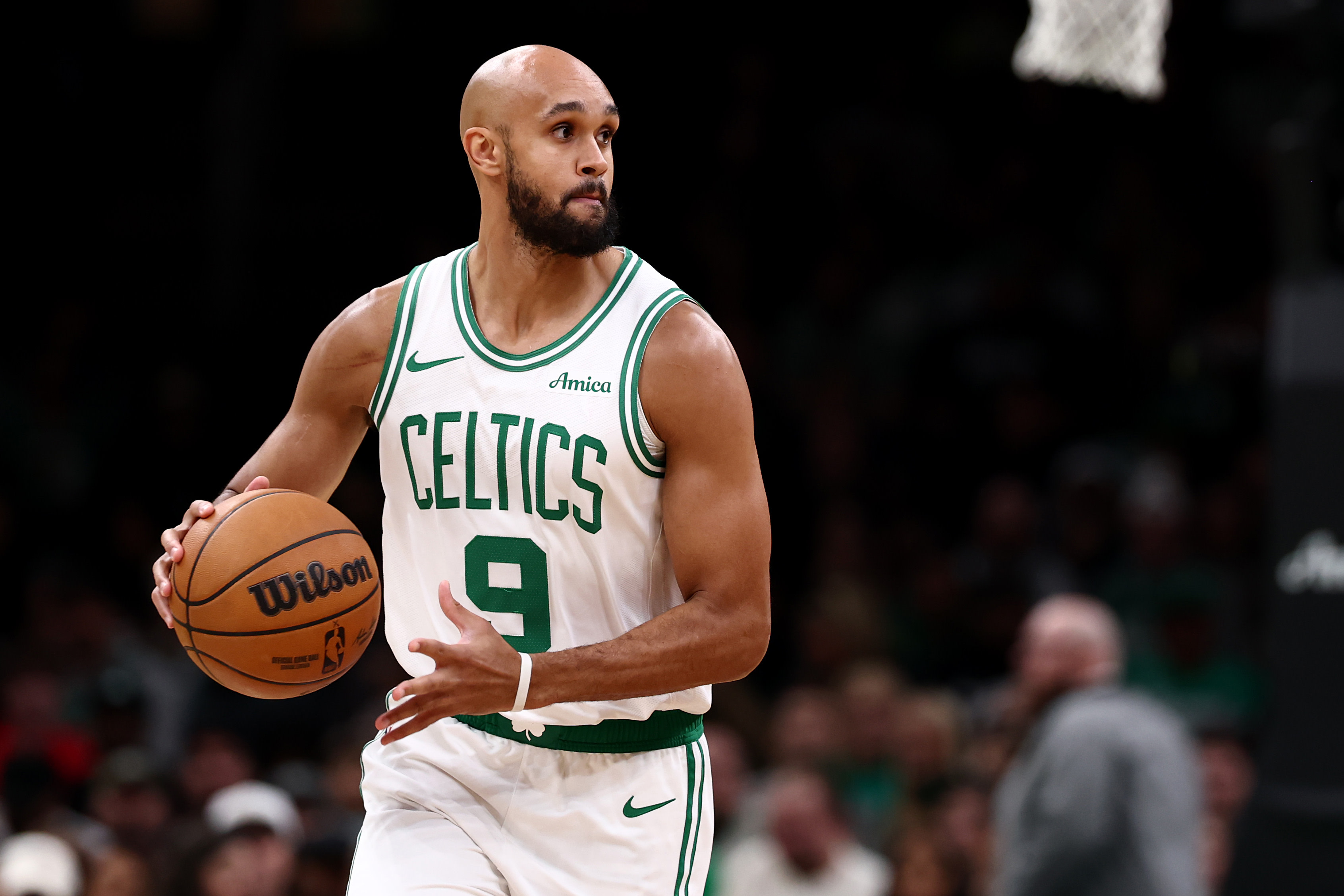 Derrick White looks to pass the ball. 