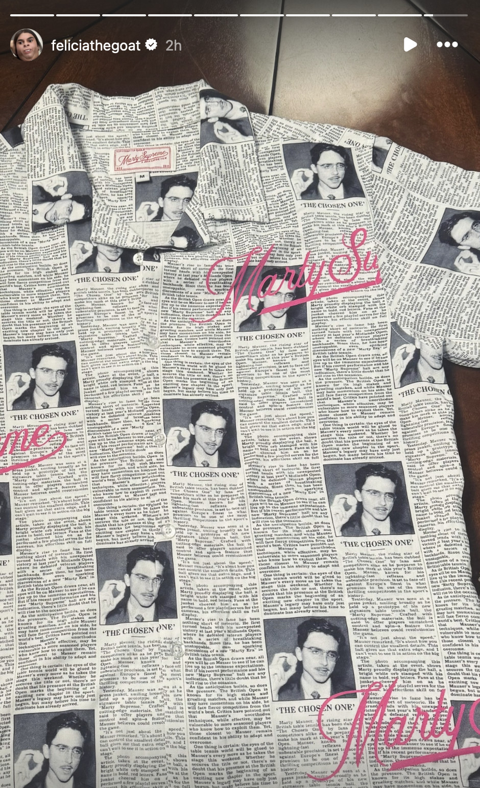 A shirt with a newspaper print design featuring repeated photos of a man labeled 