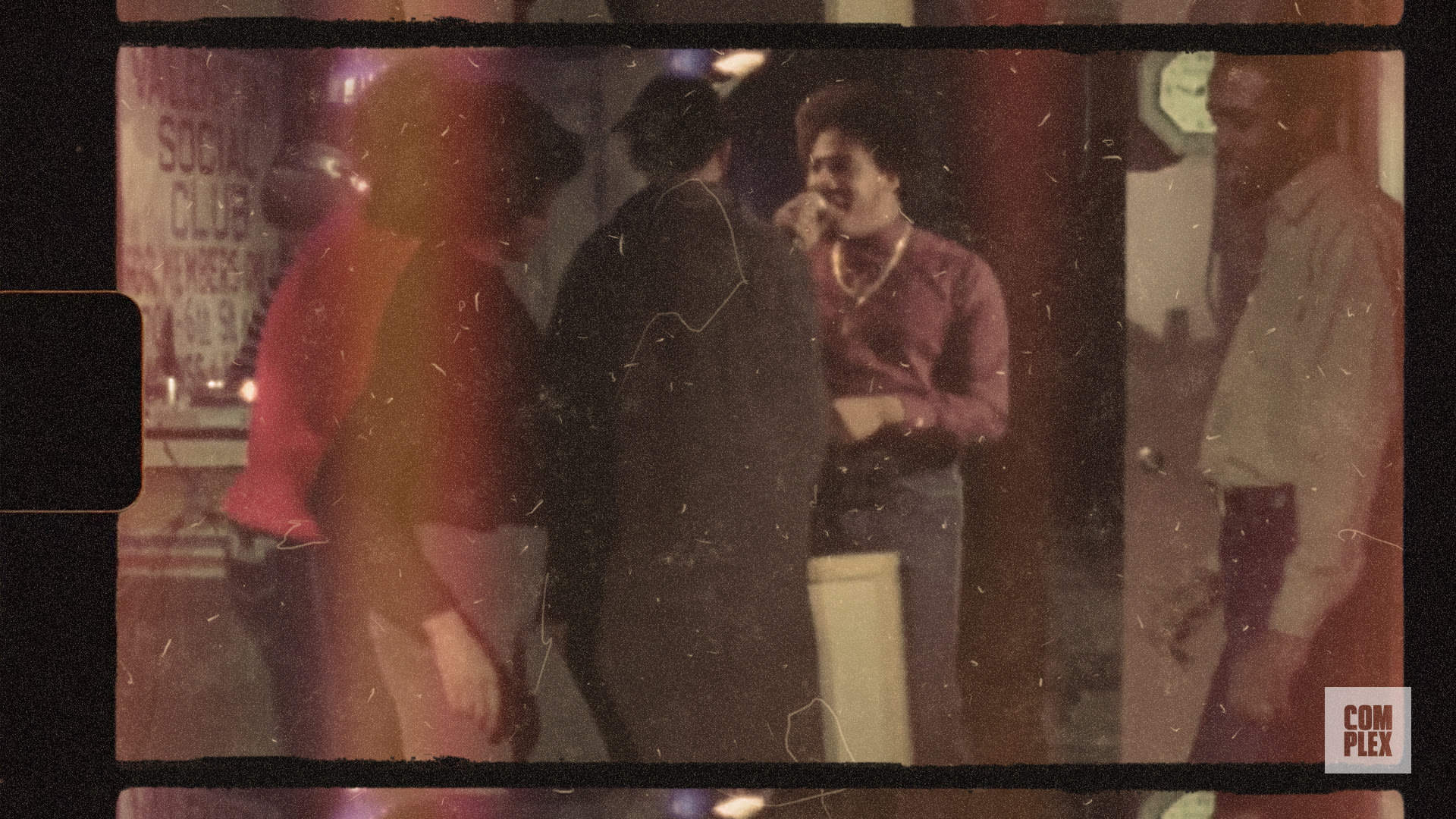 A vintage-style image showing a group of people in conversation near a 