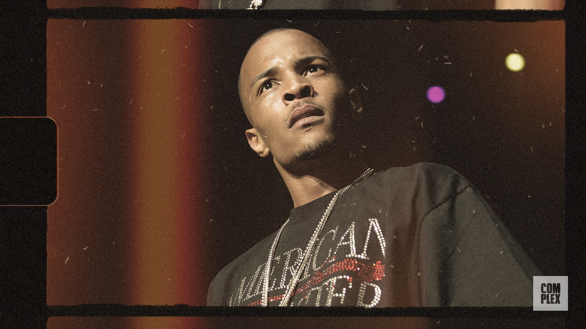 Rapper T.I. is on stage wearing a dark shirt with 