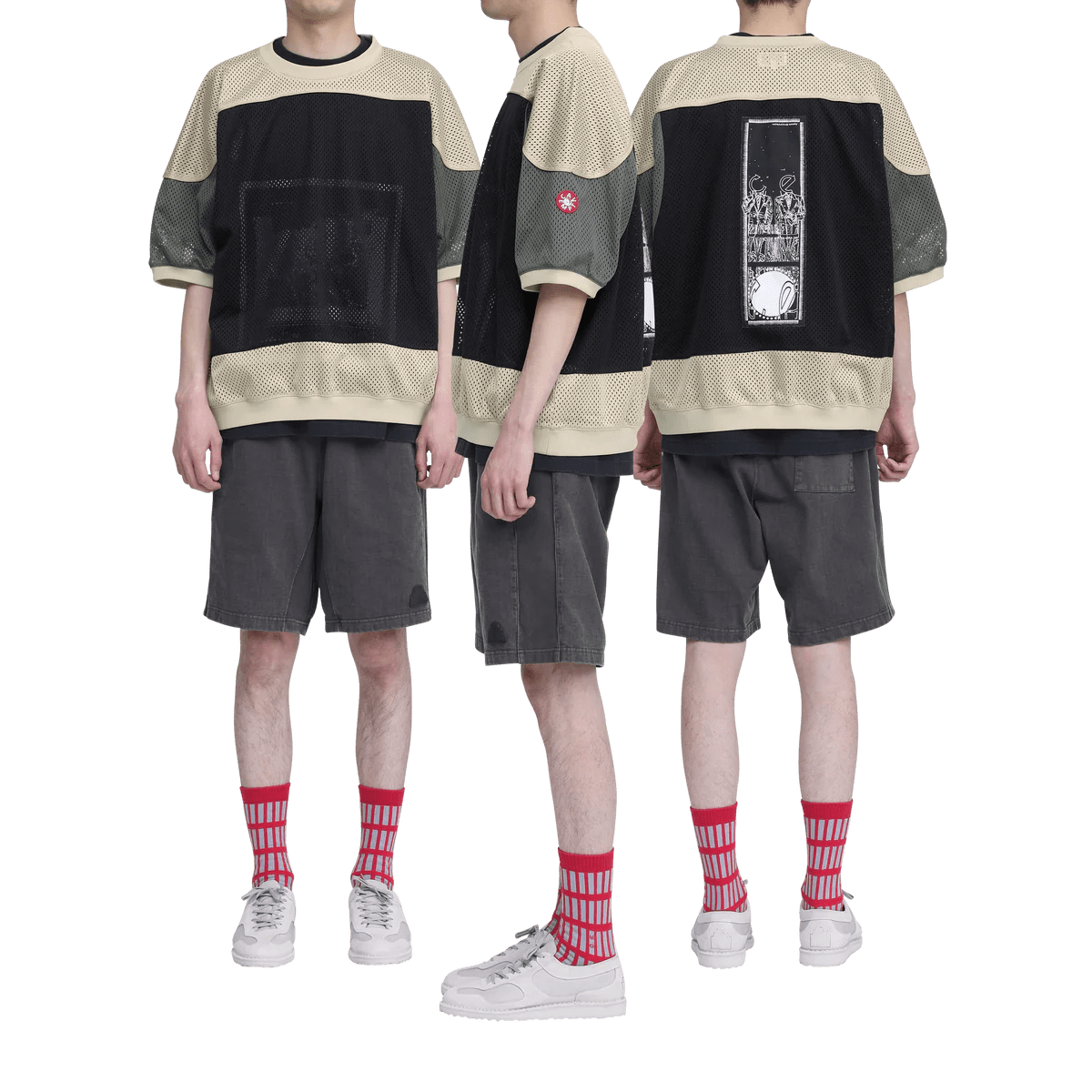 A model stands in three different poses with a green crewneck, gray shorts, and red socks